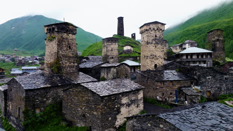 village in ushguli in georgian mountains - drone shot