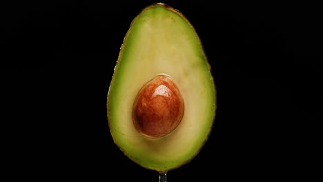 close up of a sliced avocado with seed