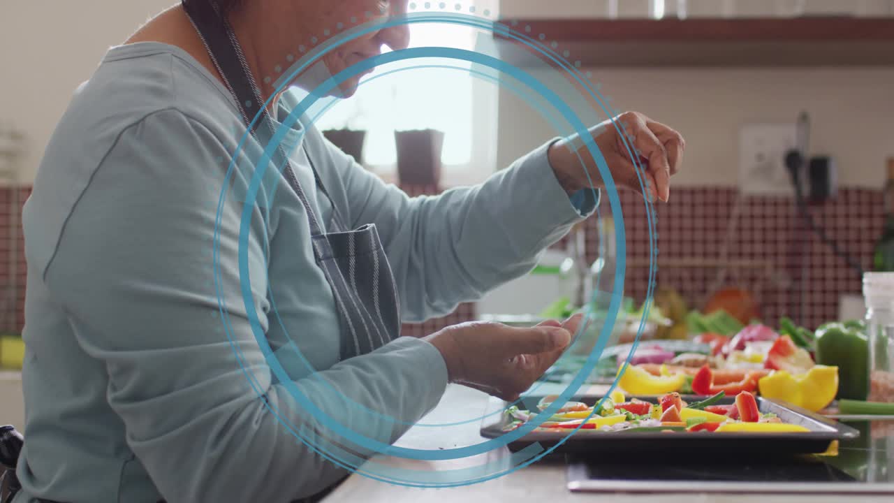Home cook pinching seasoning and sprinkling onto peppers to coat as blue overlay rings expanding