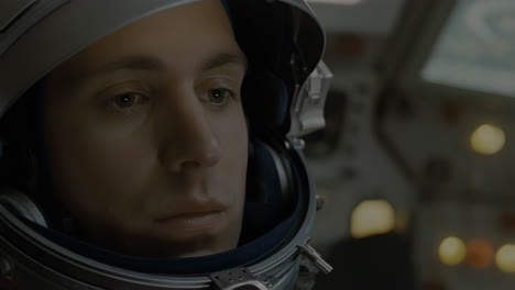 close-up of an astronaut in a space suit helmet