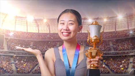 woman holding a trophy at a stadium