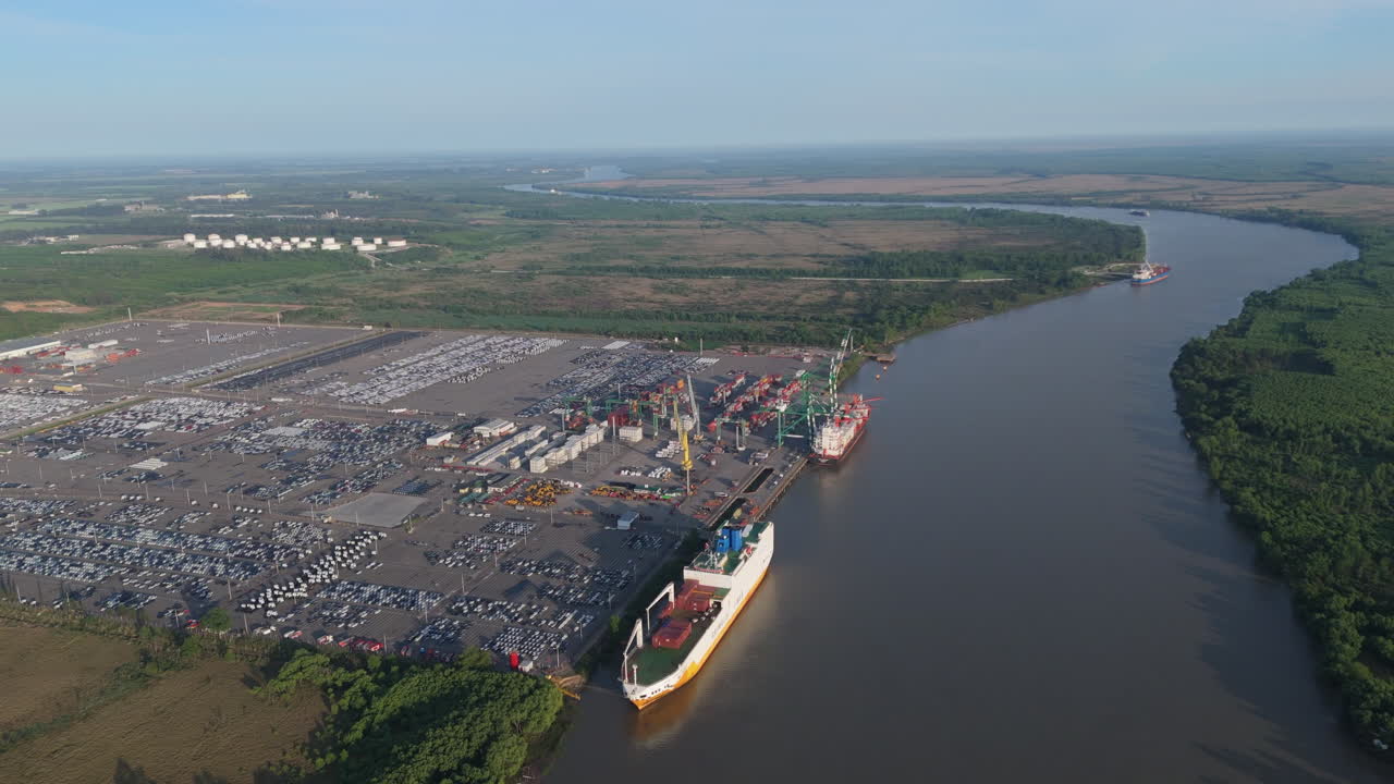 Flying over cargo ships moored at Terminal Zárate port on Paraná River, Argentina