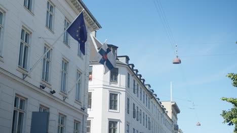 Finland-state-flag-and-European-Union-Flag-In-Copenhagen,-Denmark