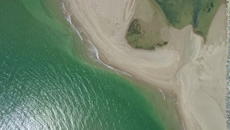 Green-sea-and-golden-sand,-Cullenstown-Wexford-Ireland