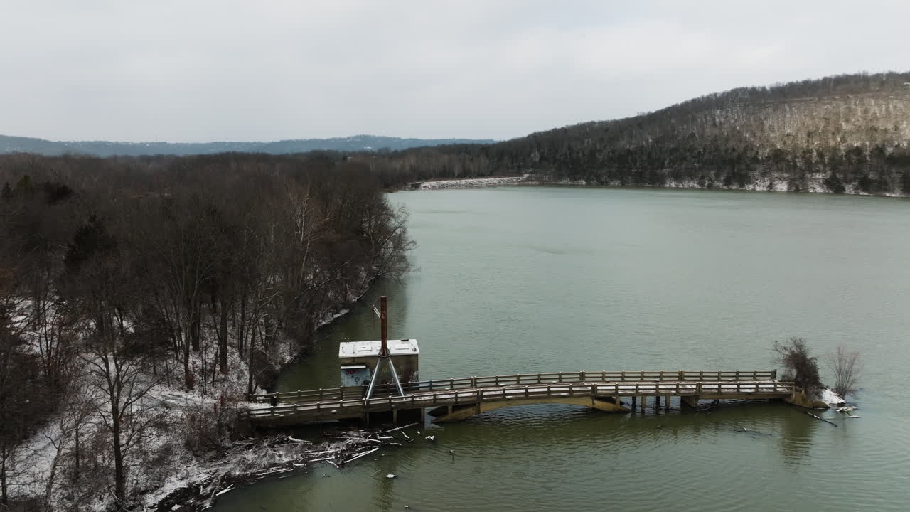 Old Bridge And Pier With Crane In Lake Sequoyah During Winter In Arkansas