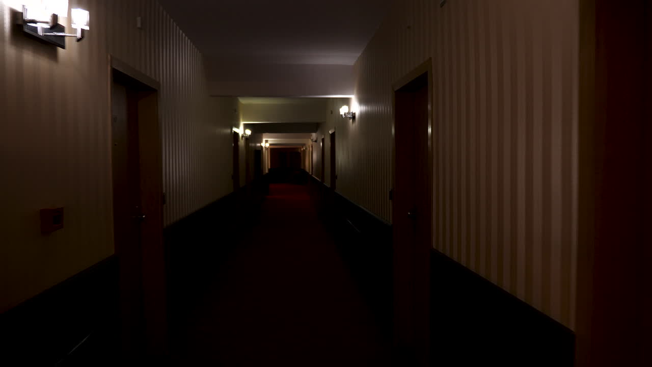 POV footage walking in poorly lit hotel hall