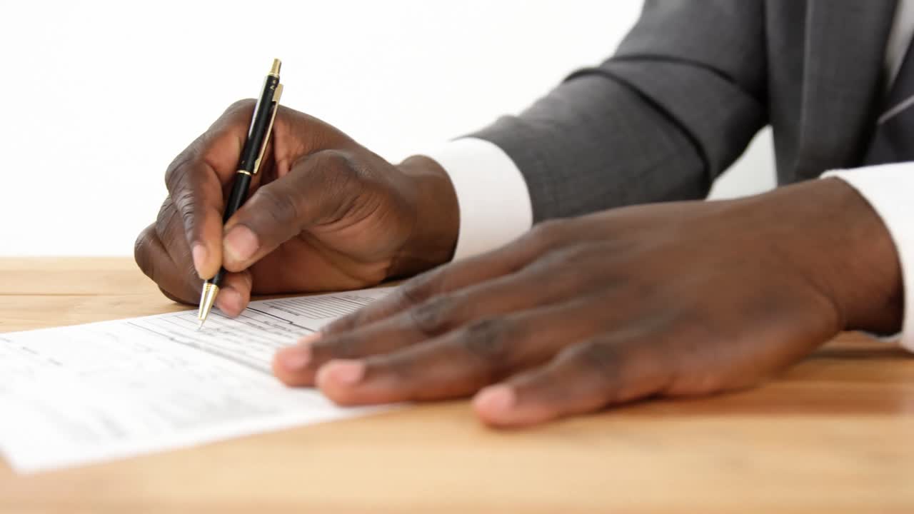 Businessman filling a insurance form