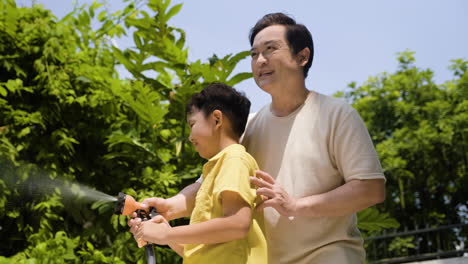 asian man and boy in the backyard