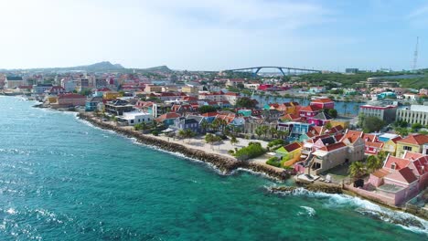 Aerial-panoramic-overview-of-Willemstad-Curacao-and-Queen-Juliana-bridge-at-midday