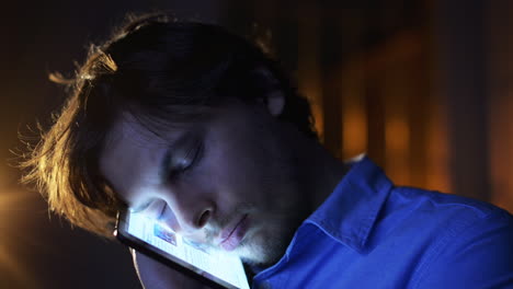 man sleeping on tablet computer touchscreen close-up touching