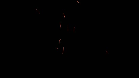 bright orange sparks flying upwards against a deep black background, creating a dynamic and energetic display that captures the essence of motion, heat, and vibrant energy