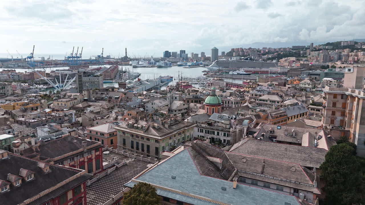 Aerial over heart of Genoa skyline with view of Porto Antico, Liguria