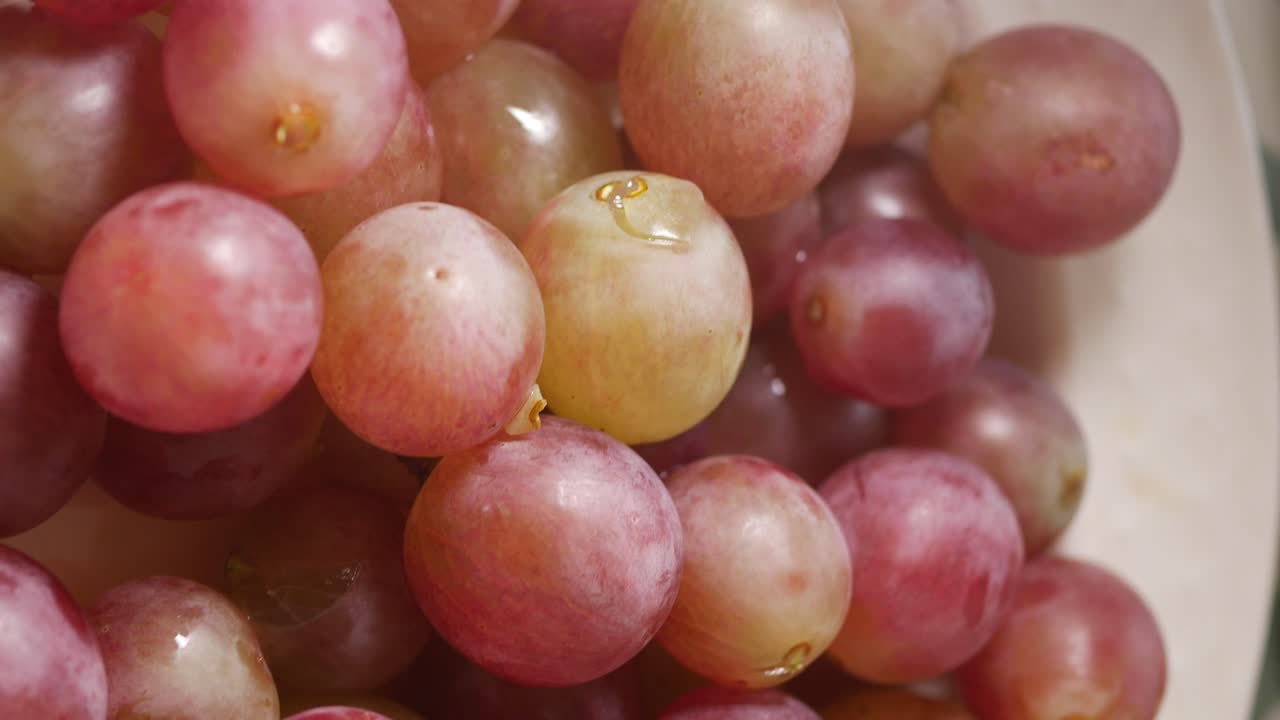 Close-up of Fresh Red and Green Grapes with Water Droplets