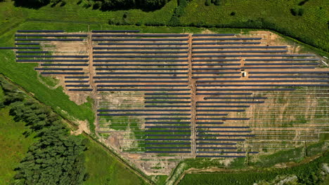 huge solar panel field under construction, aerial top down view