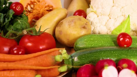 assorted vegetables arranged on a white background