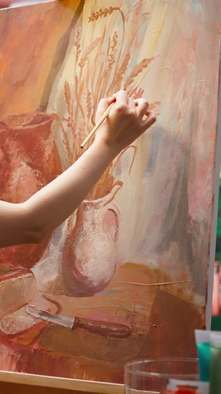 Artist's Hand Painting a Still Life on Canvas