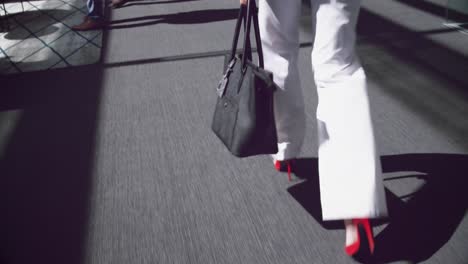 woman walking in the corridor at office 4k