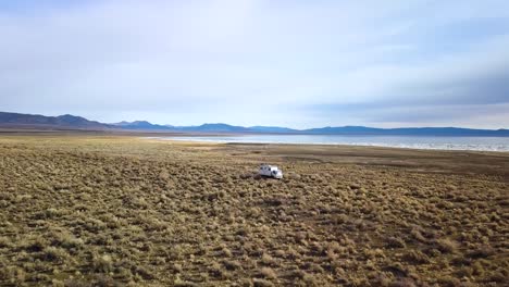 zoom out shot with a drone, mountain view over the lake