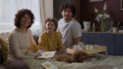 family celebrates easter in bed