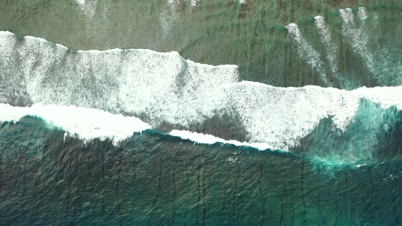 Beautiful scenery of ocean with white waves splashing and foaming on shore of tropical island with sandy beach in Myanmar