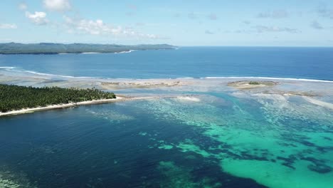 aerial drop down shot of brgy. sta. fe reef on siargao island