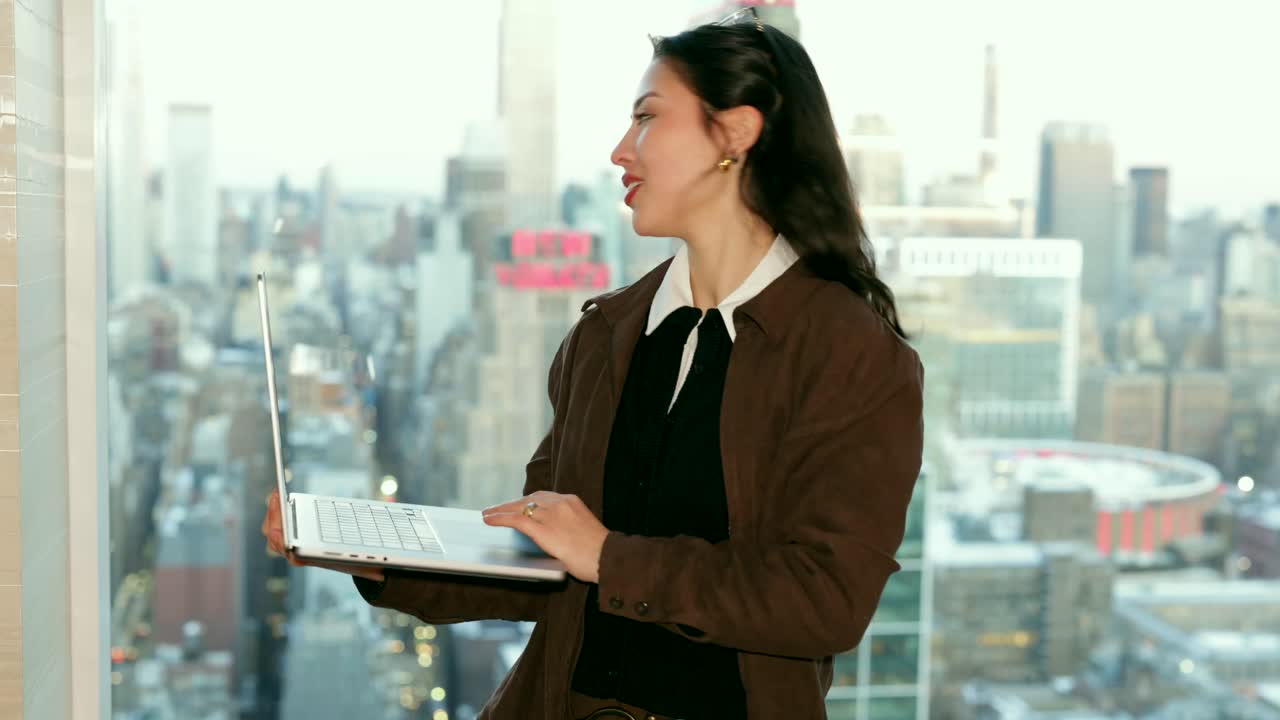 Businesswoman with laptop in city office