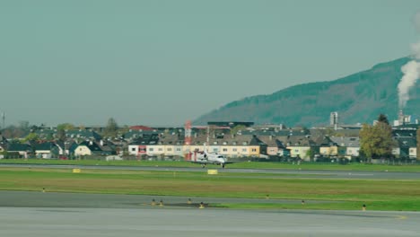 private jet landing at scenic austrian airport salzburg located within the mountains