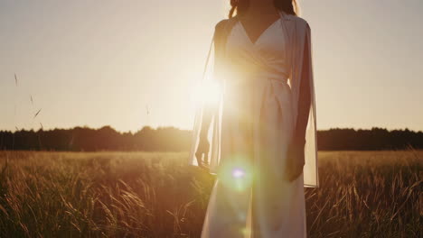 elegant woman in dress at sunset