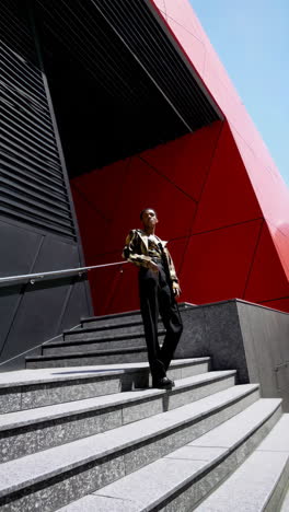 stylish man on modern architectural stairs