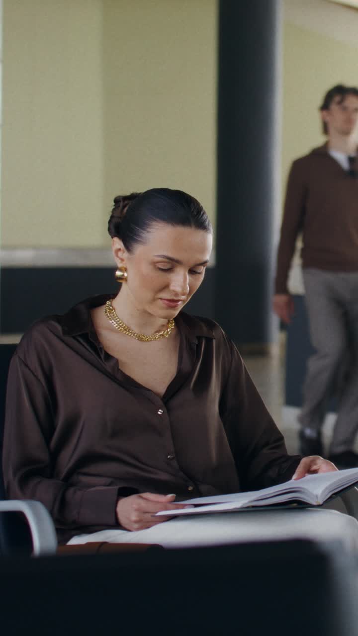 Woman Reading in Waiting Area