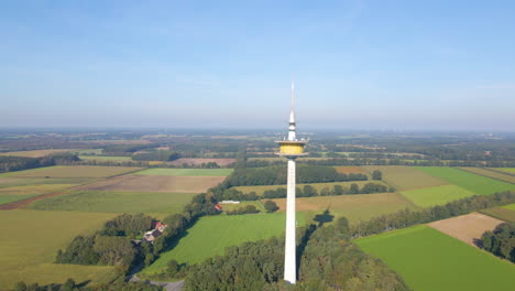 broadcast tower on the scenic landscape of dotternhausen in germany - aerial drone shot