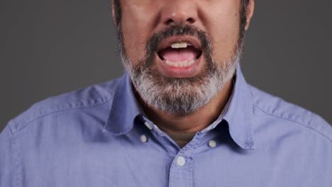 middle aged man visibly annoyed and shouting portrait