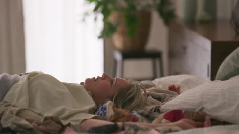a woman lying in bed