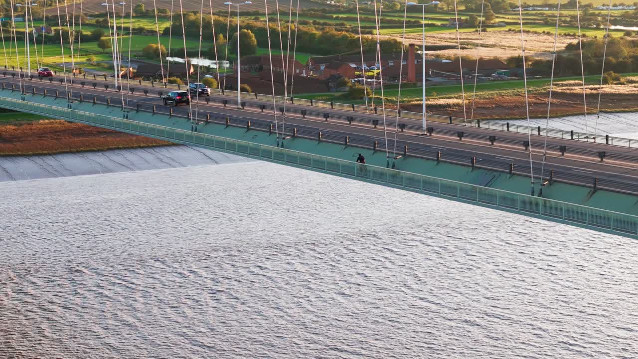 Twilight's embrace: Humber Bridge, cars painting a serene picture from a bird's-eye view