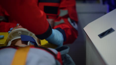 paramedics performing first aid help of patient