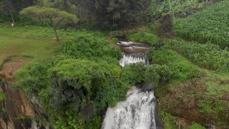 aerial shot moving forward over the top of sipi falls towards sipi river on top of the plateau