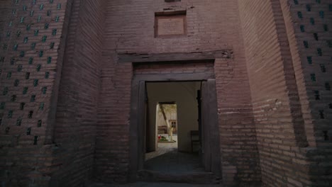 khiva ichan kala fortress safarjan mausoleum front view in the evening, uzbekistan