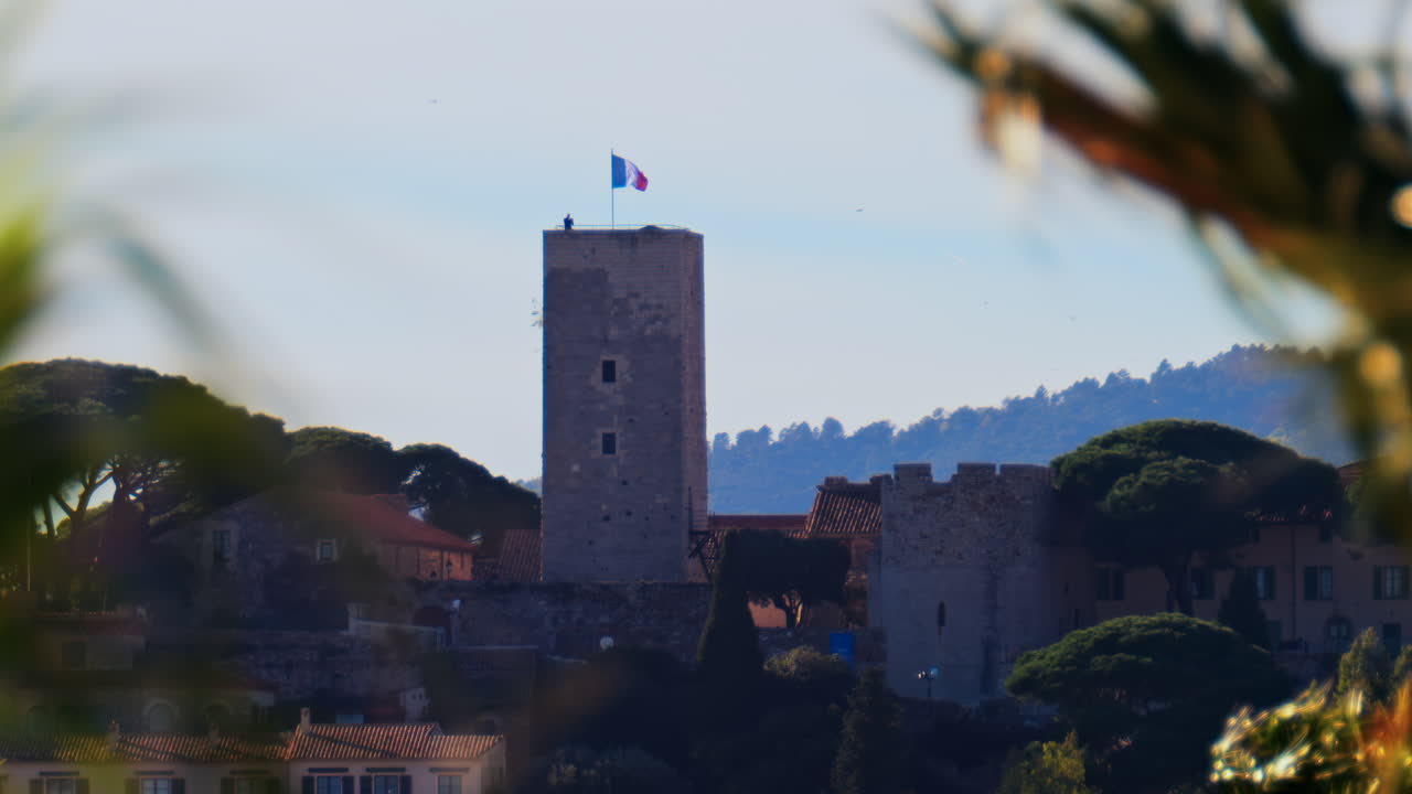 Distant view of the Goya Museum in Castres, France with the french flag on top of it