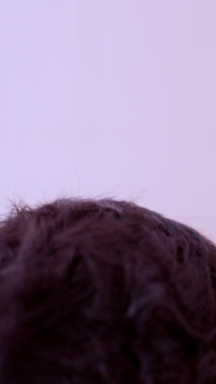 Sleepy man waking up and washing face in bathroom