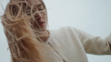 woman with blonde hair in the wind