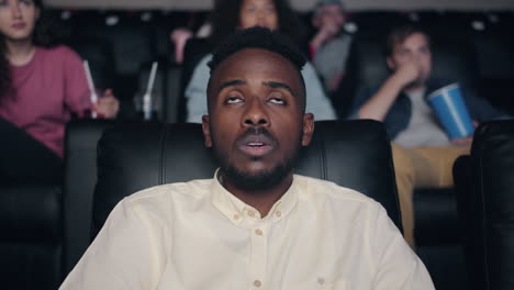 man watching movie in cinema