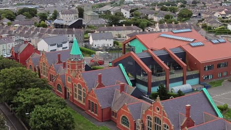 ysgol cybi welsh primary school aerial view towards green copper spire in the holyhead suburb
