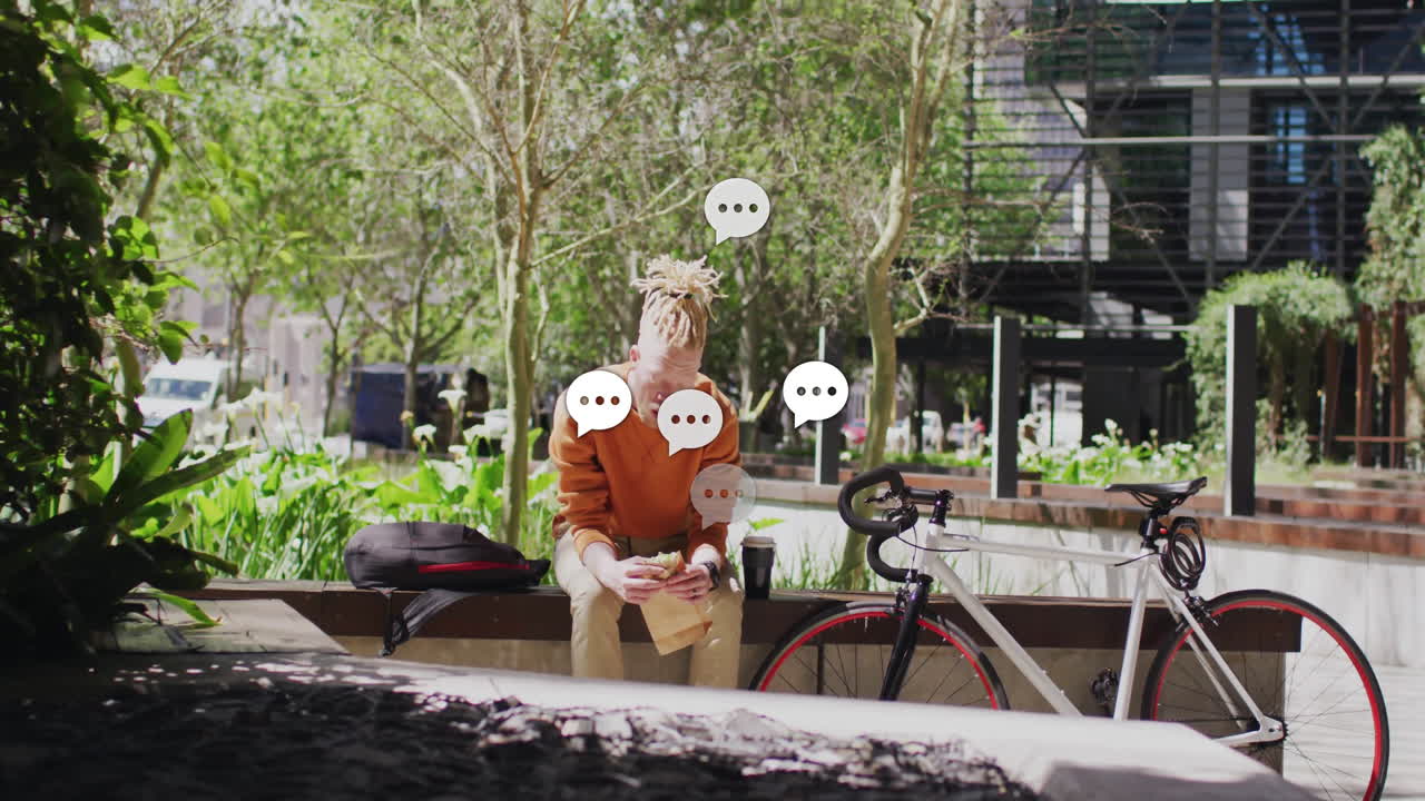 male student eating sandwich on outdoor bench, showing animated education chart and coffee cup icon