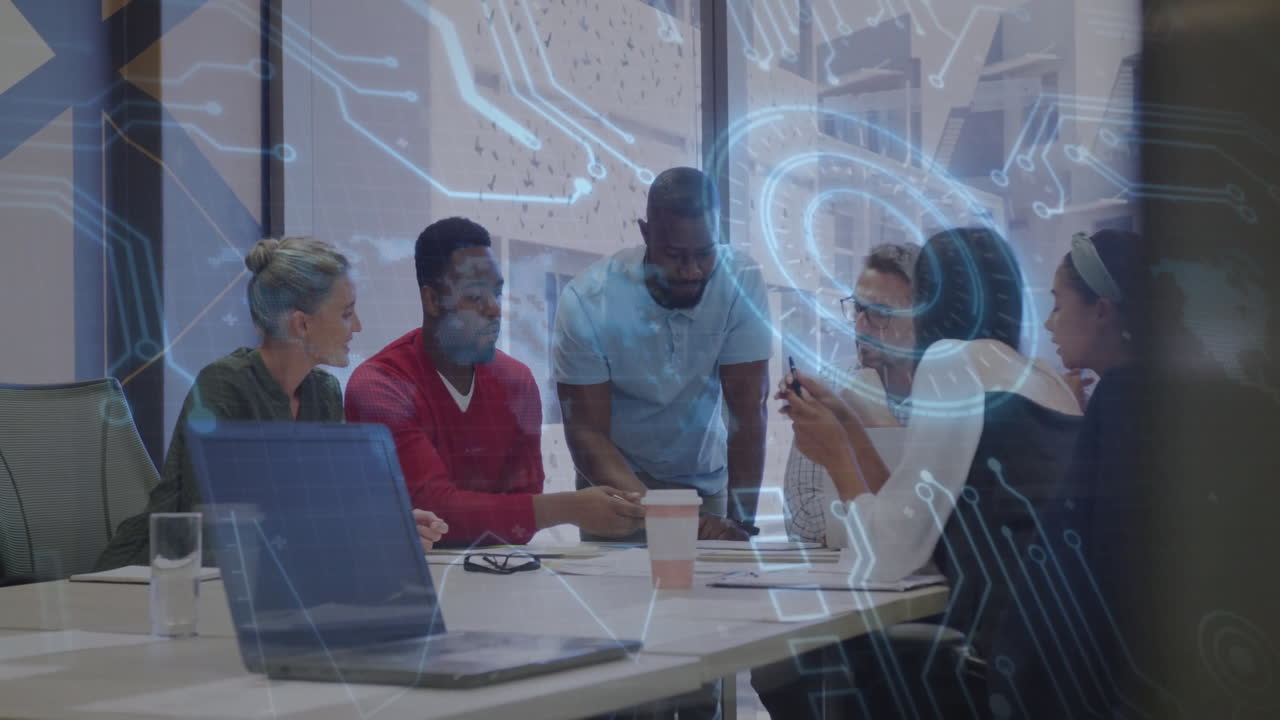 Diverse team collaborating at office with digital network overlay animation