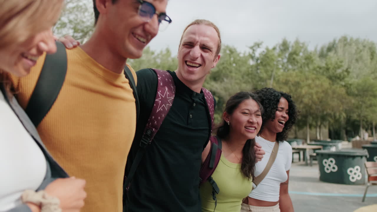 Side view of diverse group of interracial students walking, friendship and