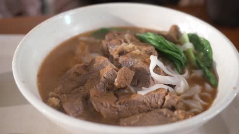 Hot-curry-lamb-masala-in-a-bowl-on-table-,