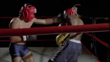 two boxers fighting in a boxing ring 1