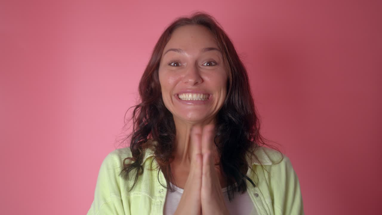 Woman clapping and smiling