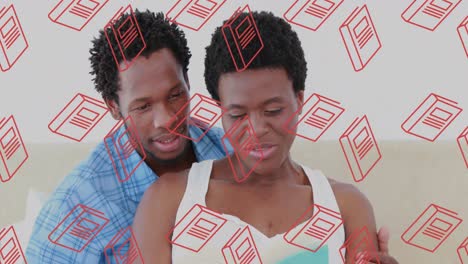 animación de iconos de libros sobre la lectura de una pareja afroamericana