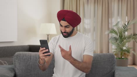 Happy-Sikh-Indian-man-talking-on-video-call